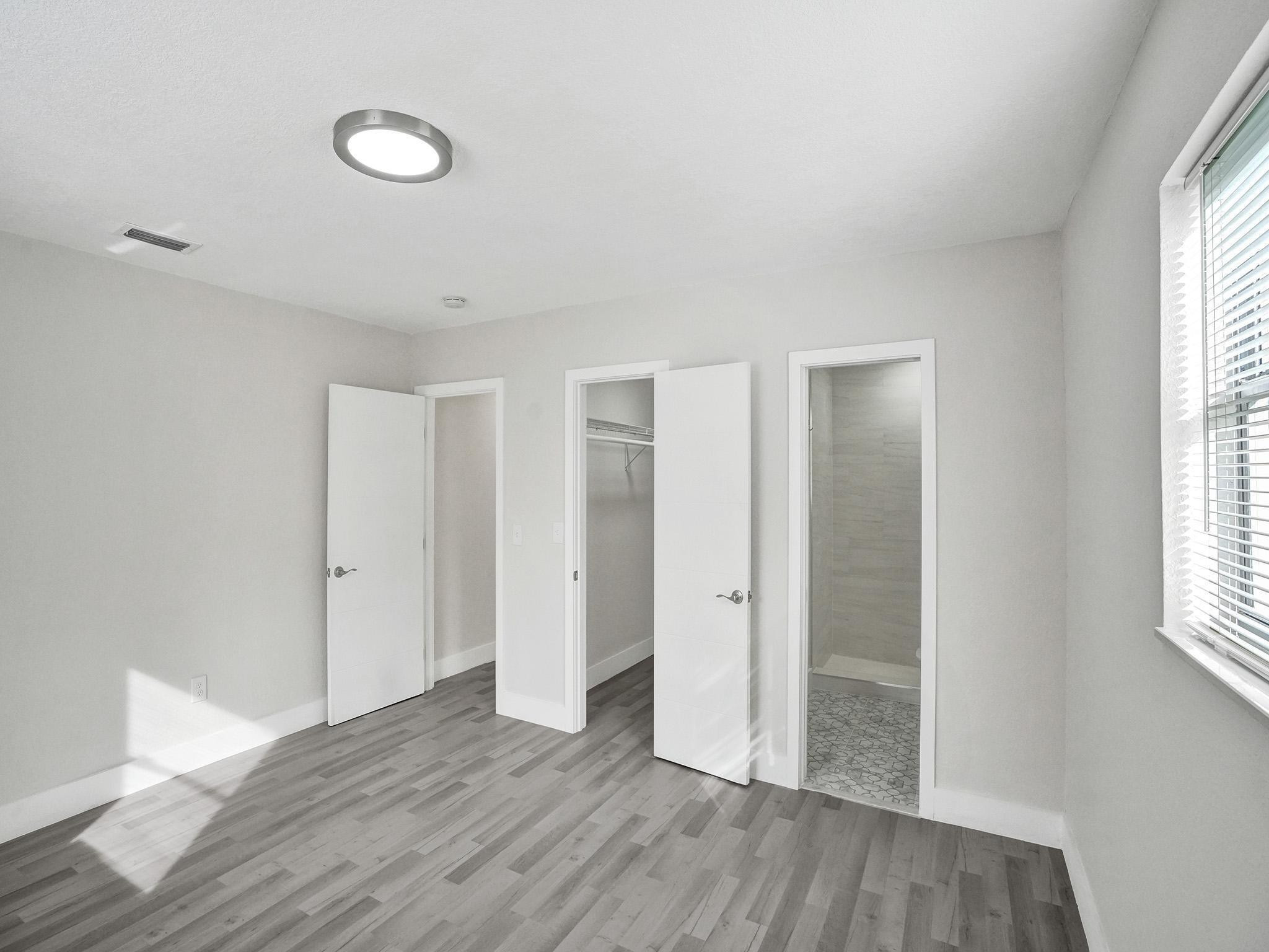 631 North 69th Terrace Hollywood, FL 33024 - Photo 8 of 60 a view of empty room with wooden floor and fan