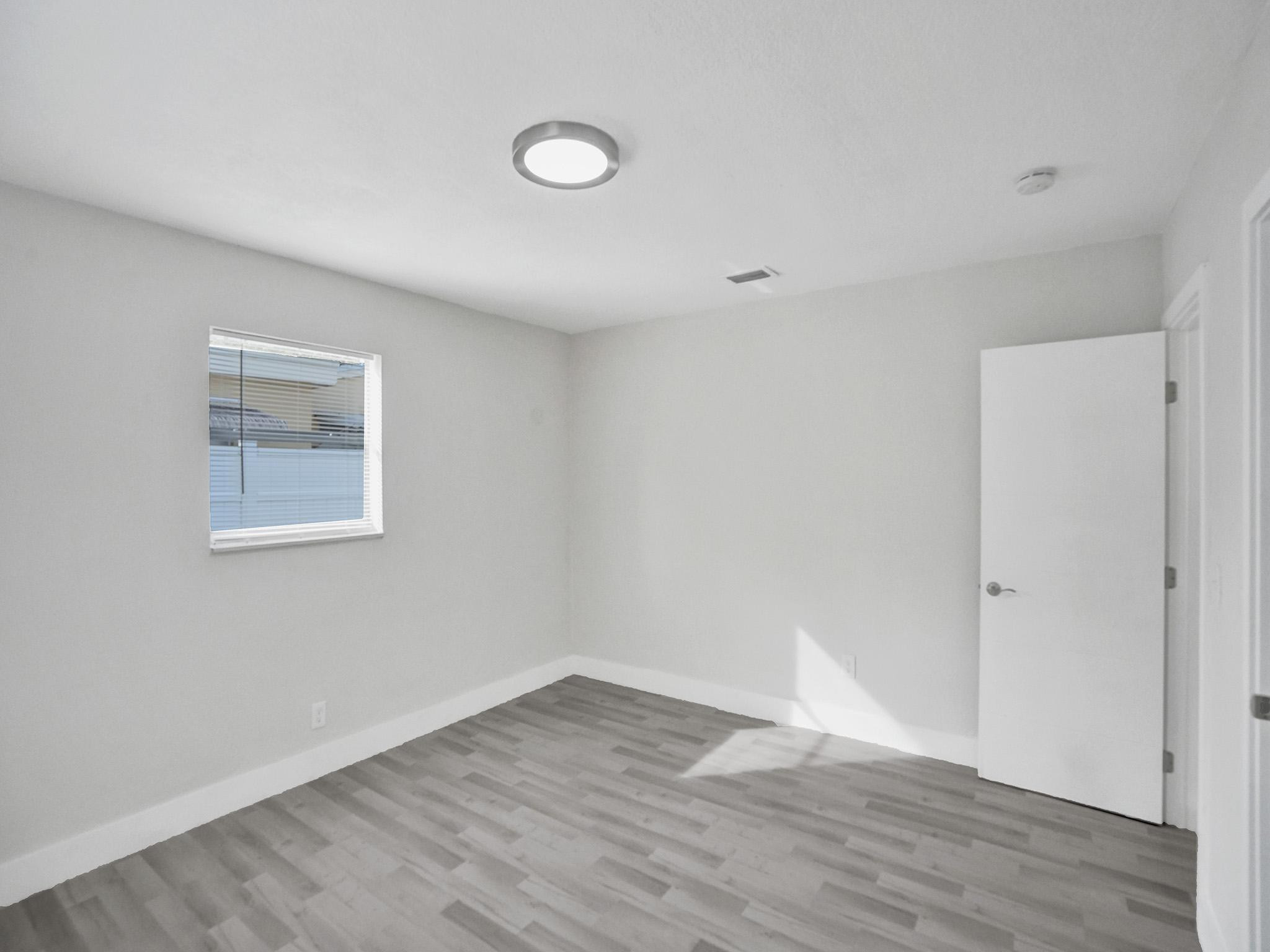 631 North 69th Terrace Hollywood, FL 33024 - Photo 10 of 60 a view of an empty room with wooden floor