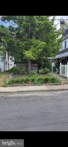 a view of a yard and front view of a house