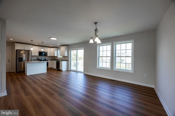 a view of kitchen with wooden floor and window
