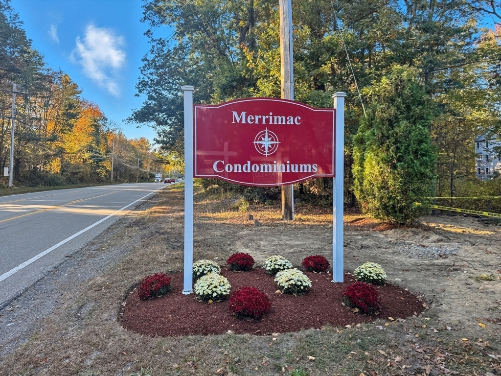 66 Compass Point, Unit 66 North Andover, MA 01845 - Photo 6 of 42 a sign on the side of the road