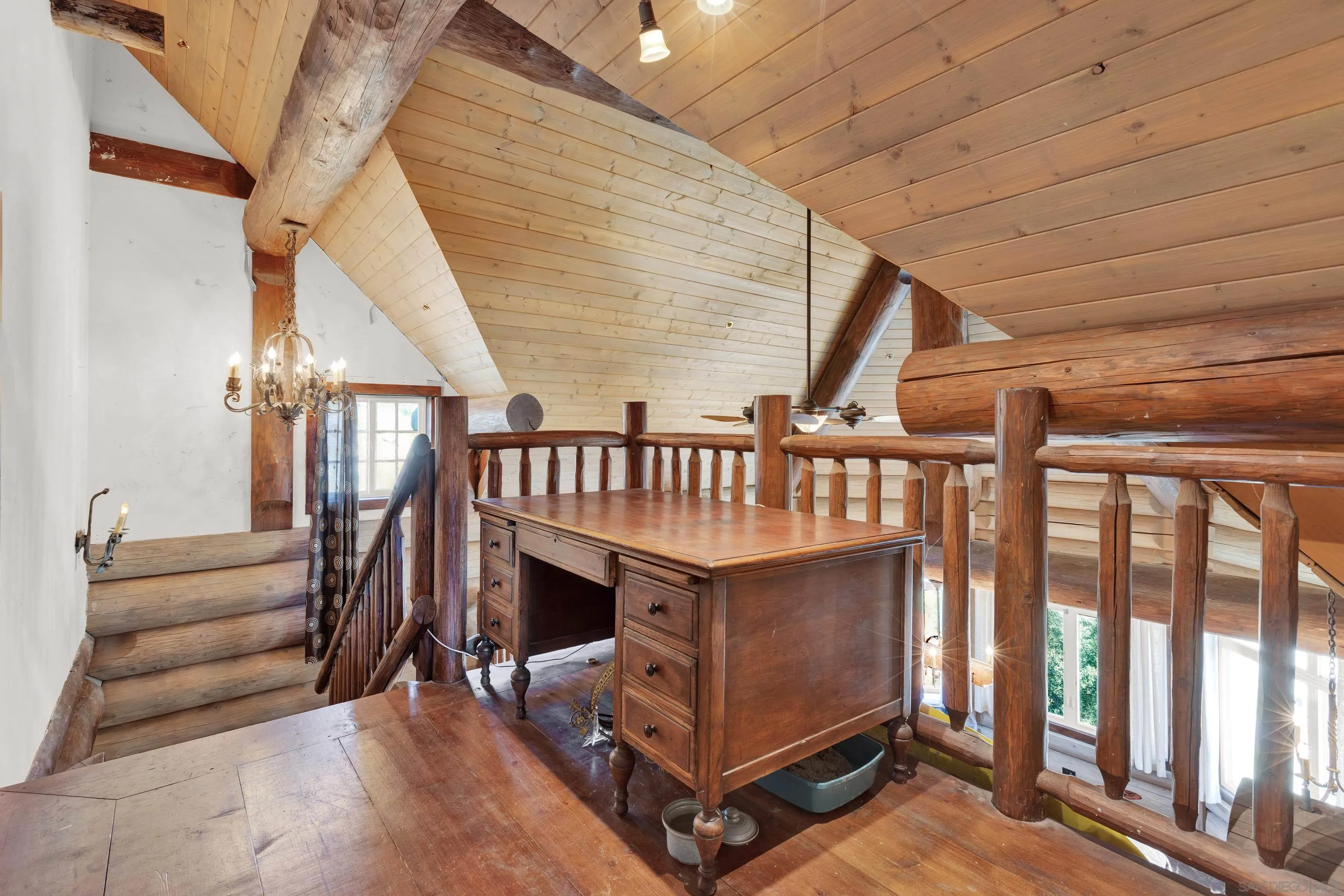 20580 Bexley Road Jamul, CA 91935 - Photo 28 of 50 a view of entryway stairs and hall with wooden floor