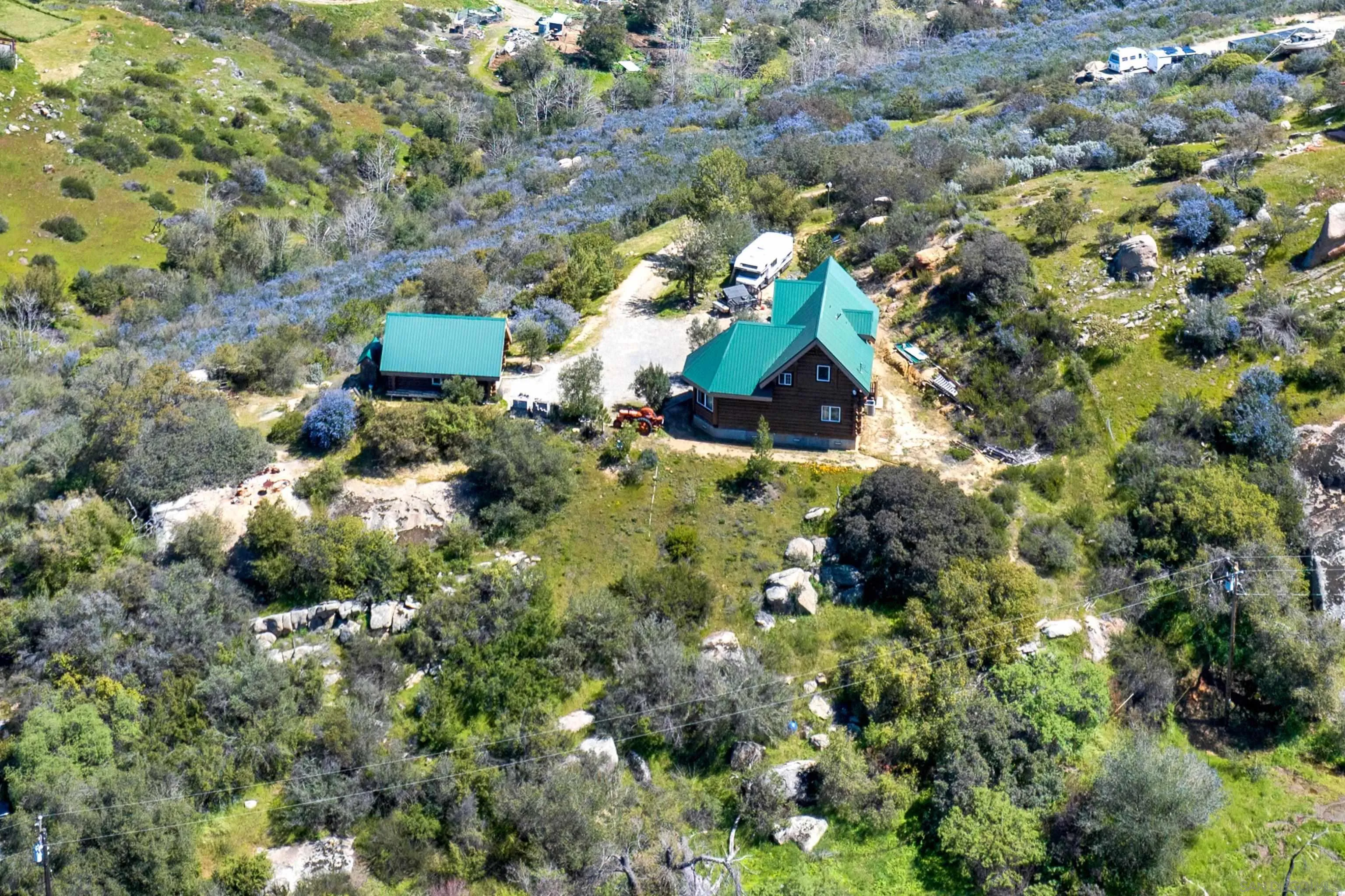 20580 Bexley Road Jamul, CA 91935 - Photo 3 of 50 an aerial view of residential house with parking and yard