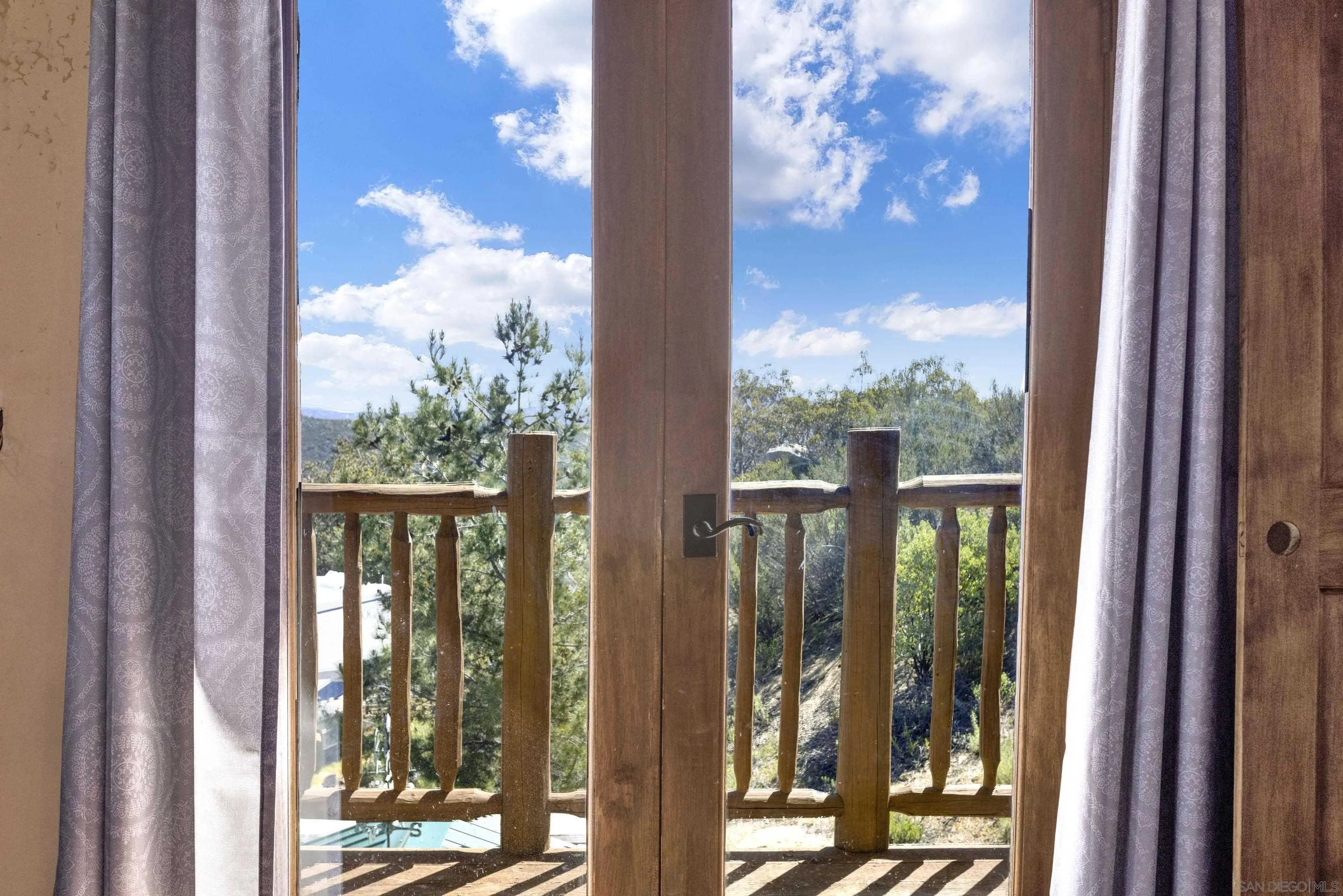 20580 Bexley Road Jamul, CA 91935 - Photo 32 of 50 a view of a balcony with wooden floor