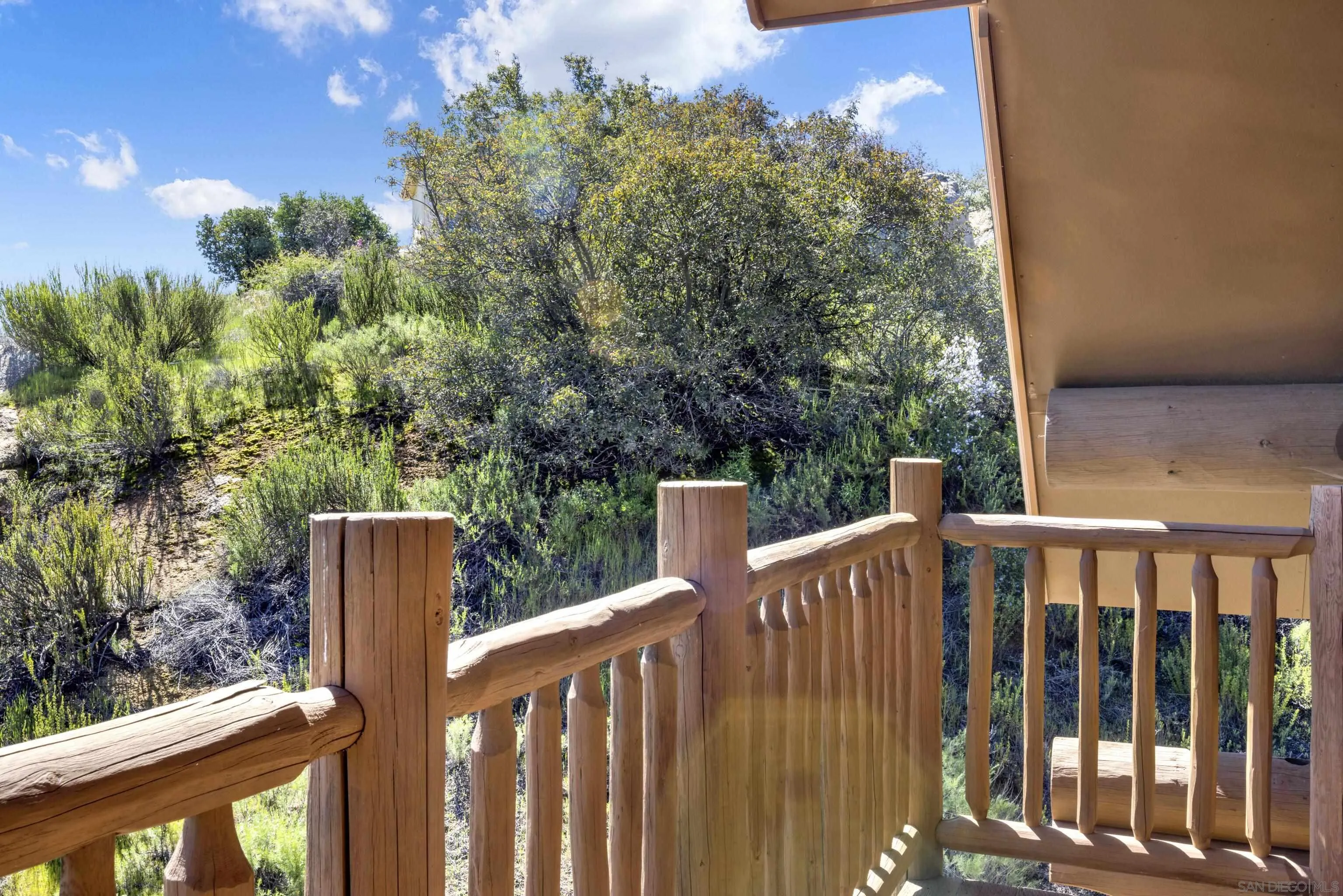 20580 Bexley Road Jamul, CA 91935 - Photo 33 of 50 a view of a wooden fence and trees