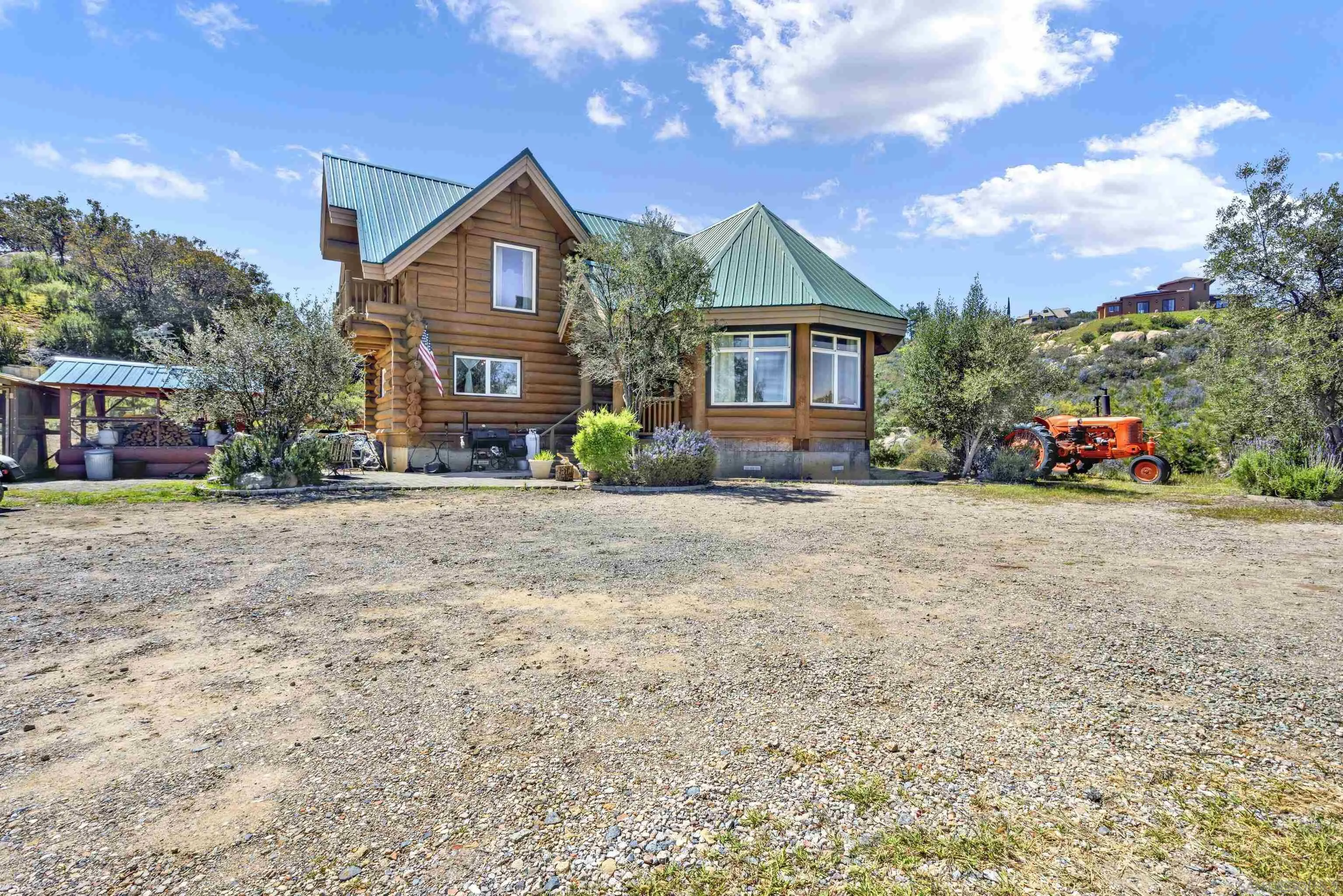 20580 Bexley Road Jamul, CA 91935 - Photo 7 of 50 a front view of a house with a yard