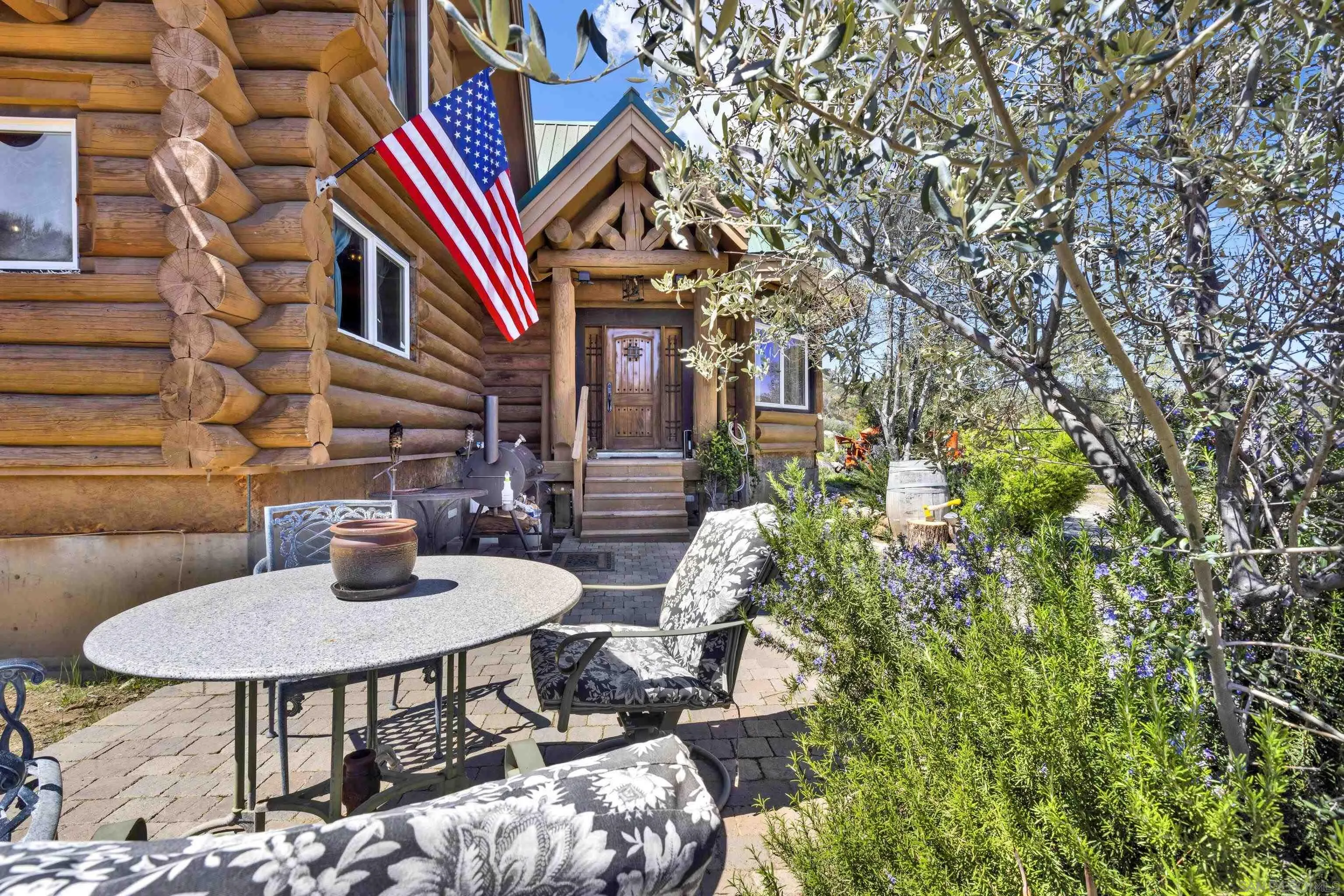 20580 Bexley Road Jamul, CA 91935 - Photo 8 of 50 a backyard of a house with table and chairs