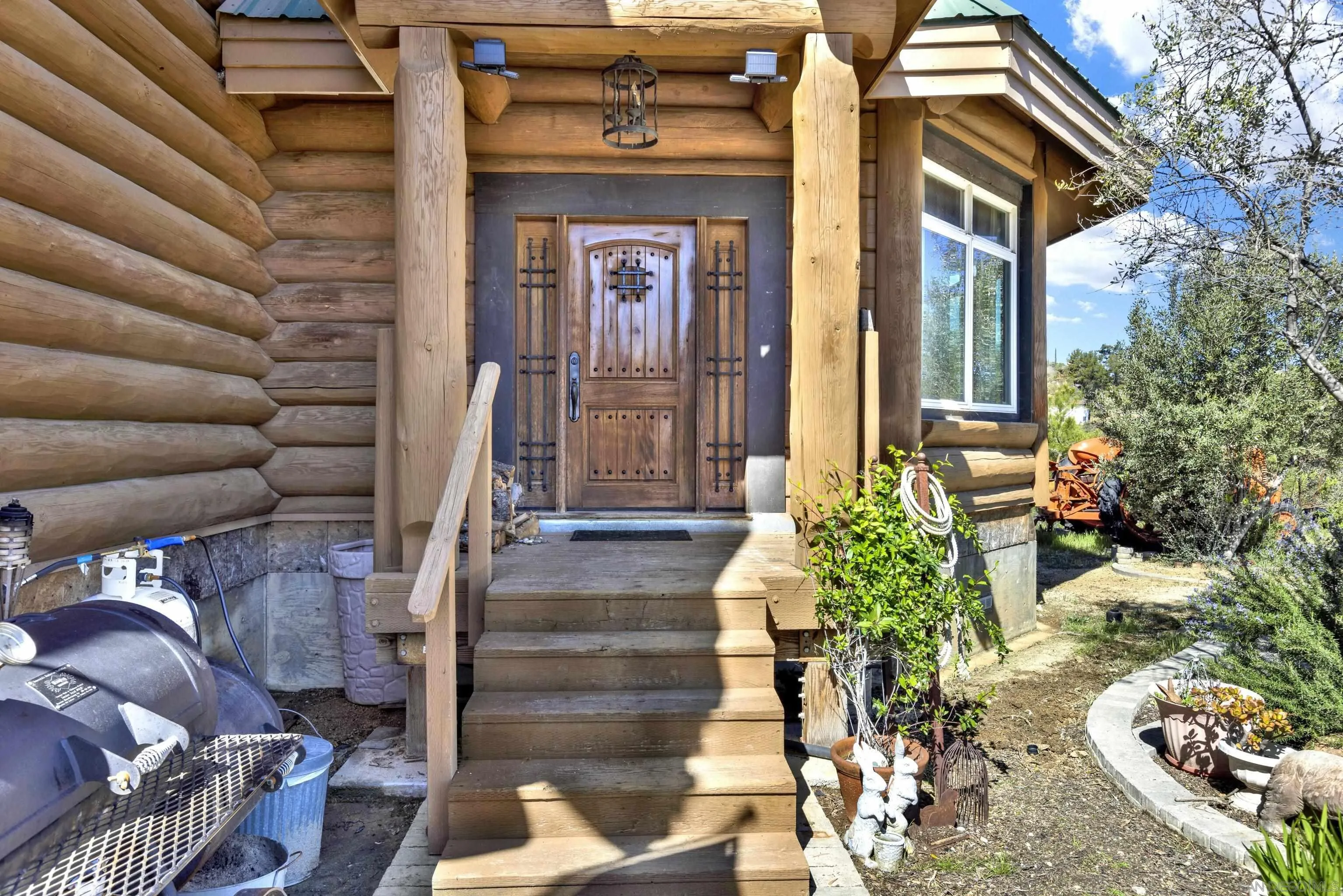 20580 Bexley Road Jamul, CA 91935 - Photo 9 of 50 a front view of a house with outdoor seating