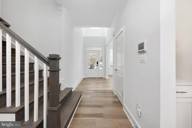 a large kitchen with kitchen island a sink stainless steel appliances and cabinets