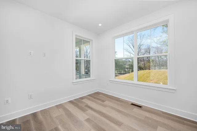 a bathroom with a toilet and a bathtub