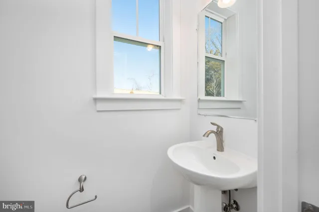 a bathroom with a vanity a sink and mirror