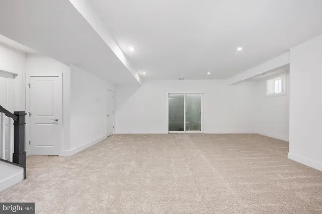 a view of a brick house with large windows