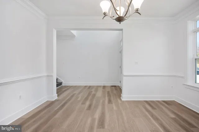 a kitchen with cabinets stainless steel appliances and a counter space
