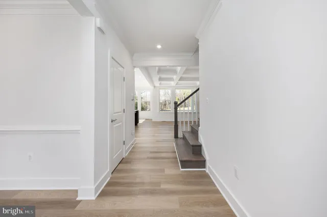 a kitchen with sink stove and cabinets