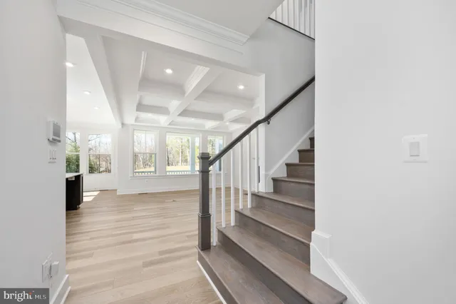 a kitchen with counter top space a sink stainless steel appliances and cabinets