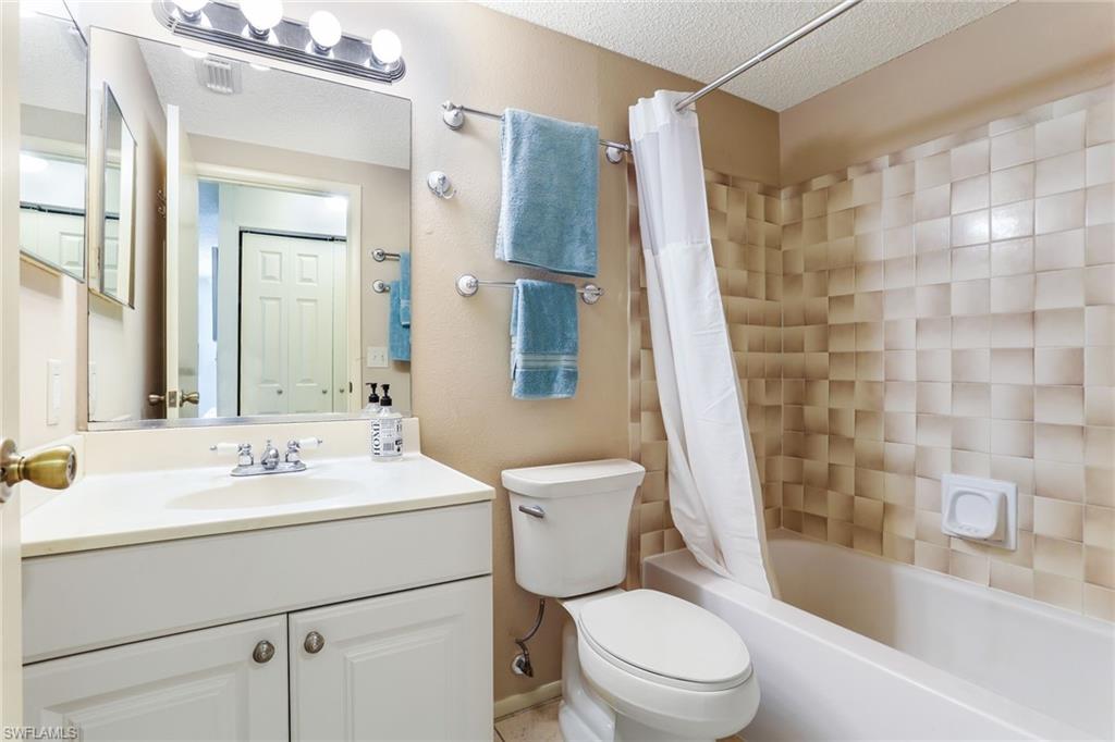 633 91st Avenue North Naples, FL 34108 - Photo 17 of 25 a bathroom with a sink toilet and shower