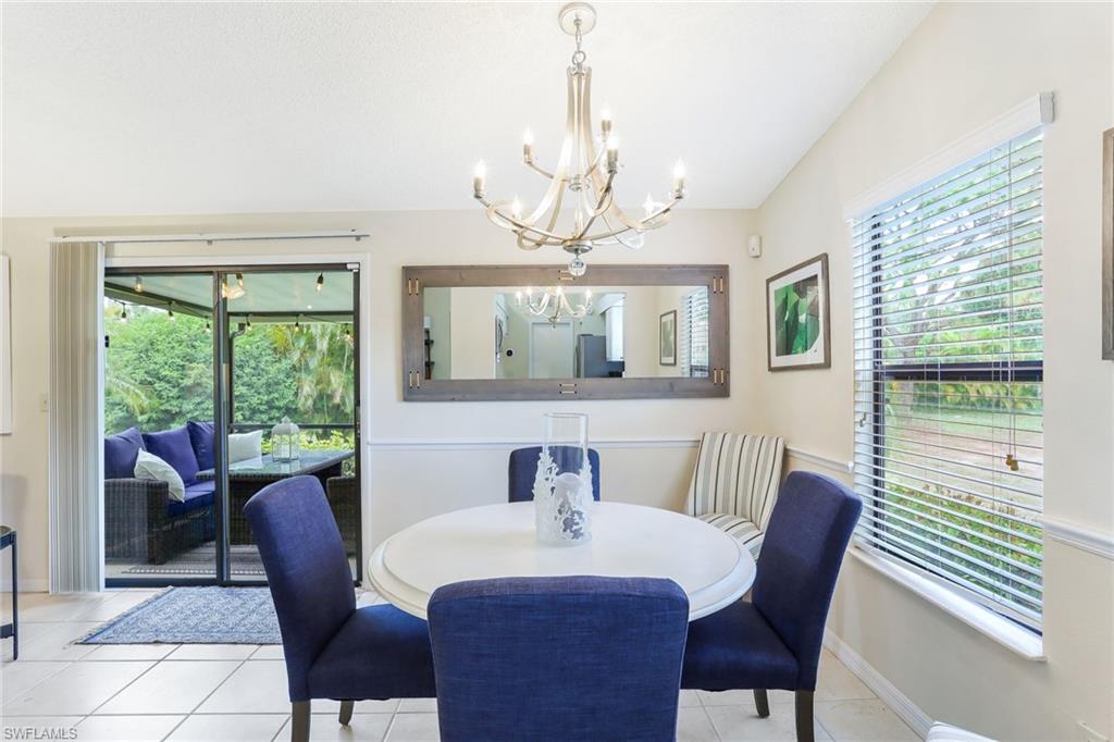 633 91st Avenue North Naples, FL 34108 - Photo 9 of 25 a view of a dining room with furniture window and outside view