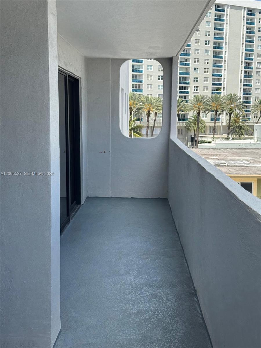 6725 Harding Avenue, Unit 503 Miami Beach, FL 33141 - Photo 20 of 23 an empty room with windows