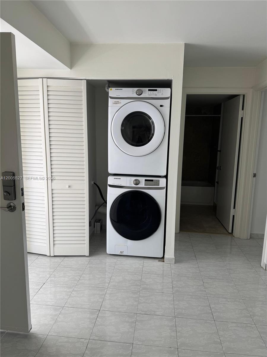 6725 Harding Avenue, Unit 503 Miami Beach, FL 33141 - Photo 9 of 23 a utility room with dryer and washer
