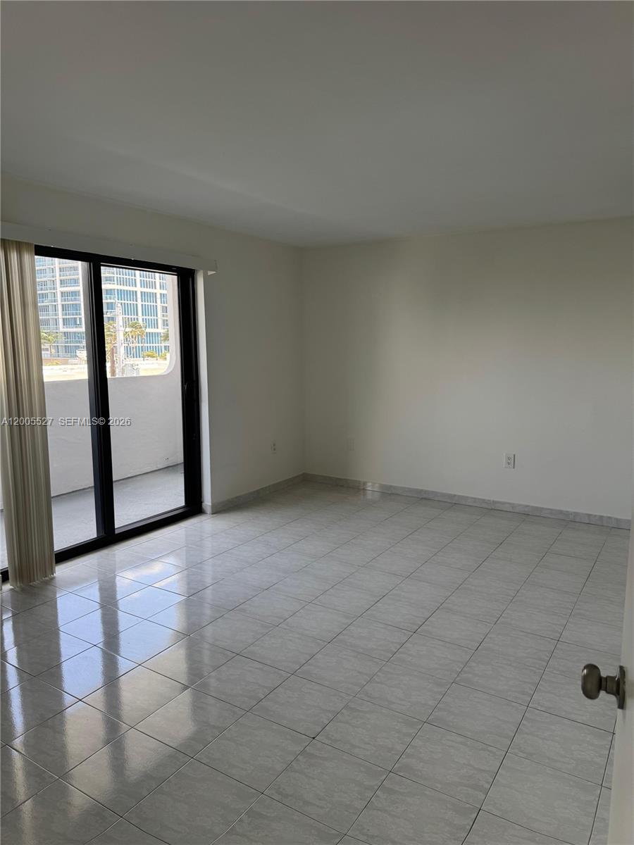 6725 Harding Avenue, Unit 503 Miami Beach, FL 33141 - Photo 10 of 23 a view of an empty room with a window