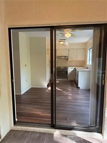 a view of room with wooden floor