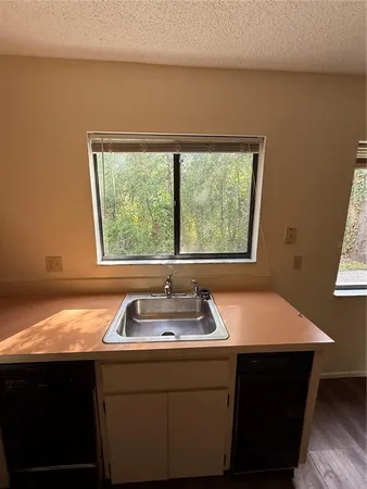 a room with a sink and a window