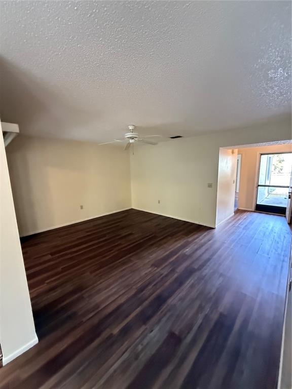 8013 Picketts Court, Unit 1 Spring Hill, FL 34613 - Photo 8 of 15 a view of an empty room with wooden floor and a window
