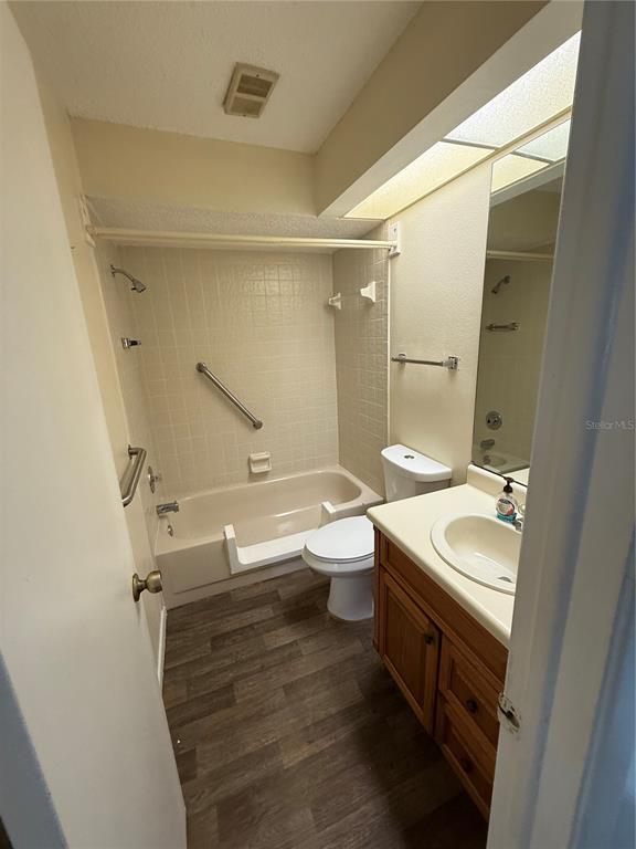 8013 Picketts Court, Unit 1 Spring Hill, FL 34613 - Photo 10 of 15 a bathroom with a sink a toilet and shower