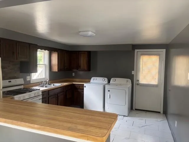 a kitchen with a stove and a sink