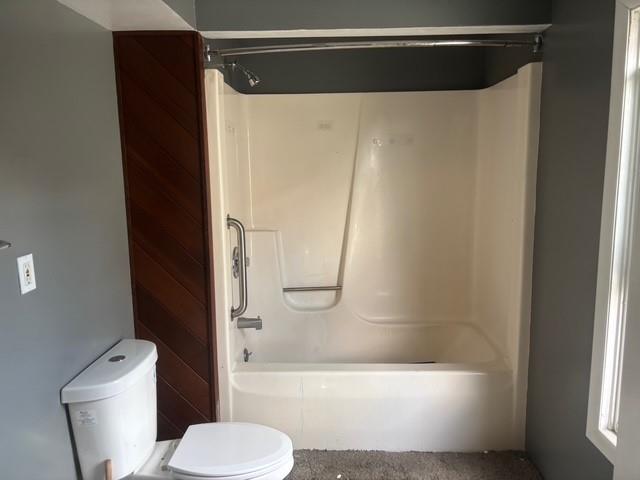 1222 Broadway Avenue, Unit 2 East McKeesport, PA 15035 - Photo 7 of 10 a bathroom with a toilet and a shower