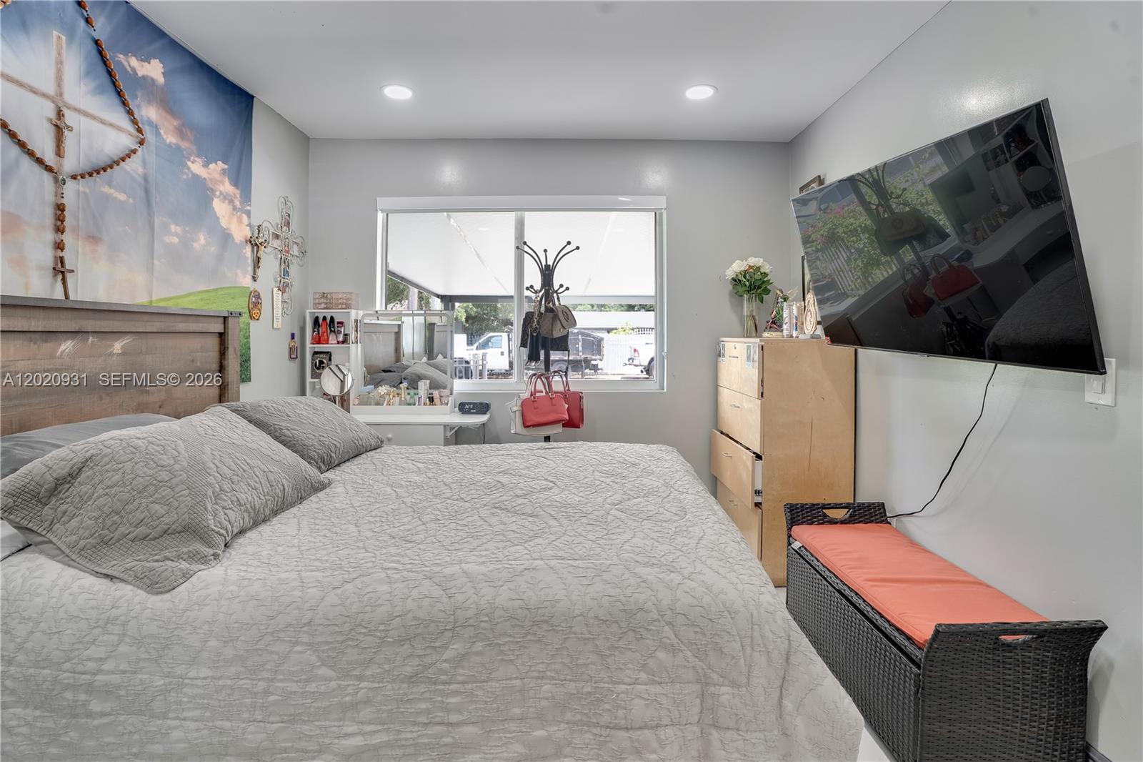 1360 Northwest 77th Street Miami, FL 33147 - Photo 20 of 41 a bed room with a bed and a flat screen tv