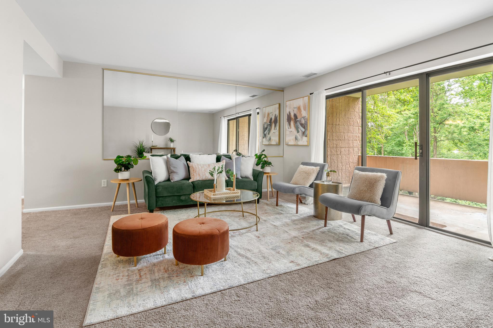 2901 Fallstaff Road, Unit 305 Baltimore, MD 21209 - Photo 3 of 13 a living room with furniture and a floor to ceiling window