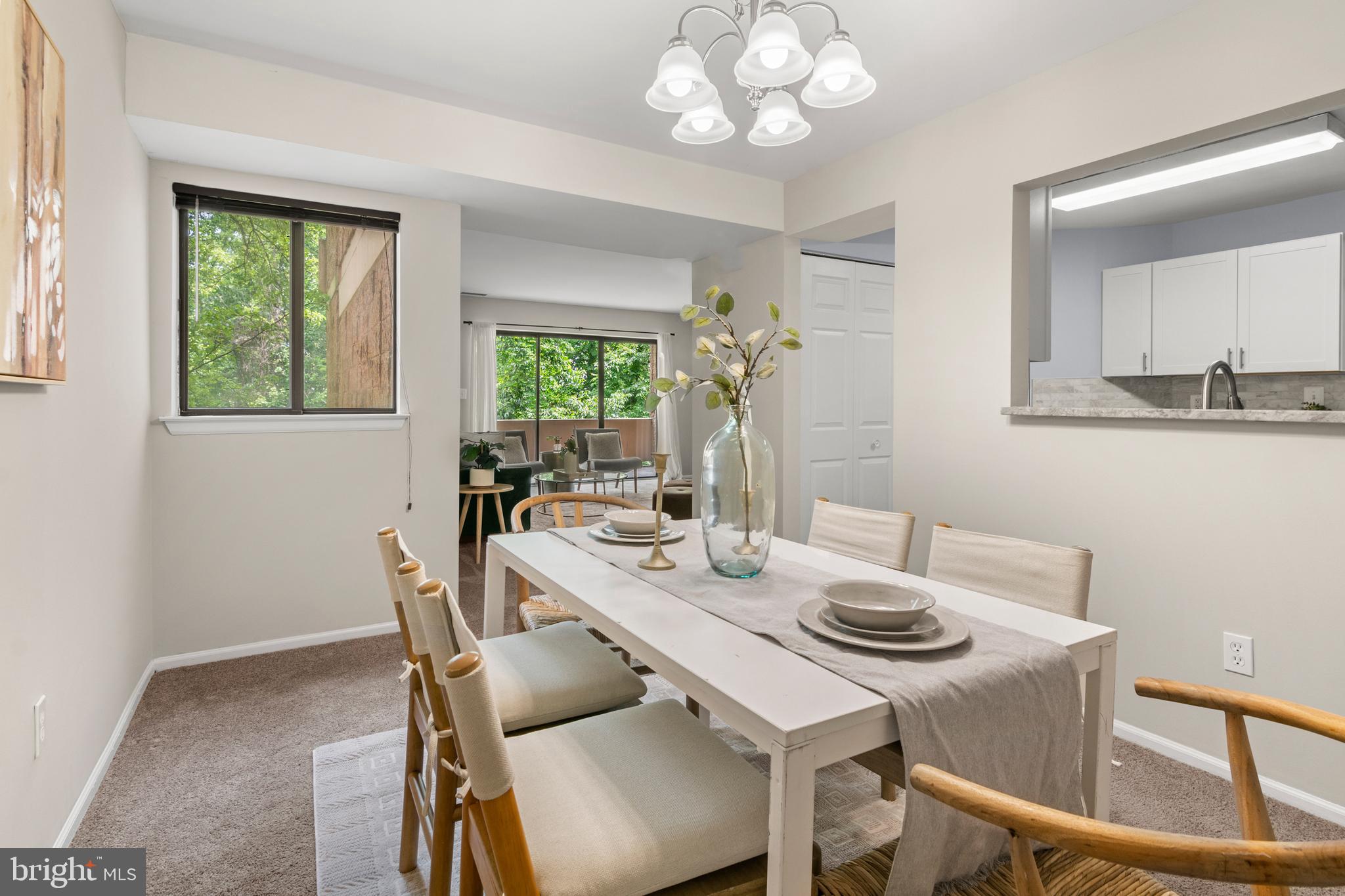 2901 Fallstaff Road, Unit 305 Baltimore, MD 21209 - Photo 5 of 13 a view of a dining room with furniture and a chandelier