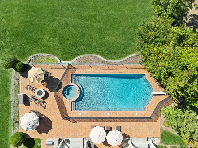 a view of house with backyard outdoor seating and garden