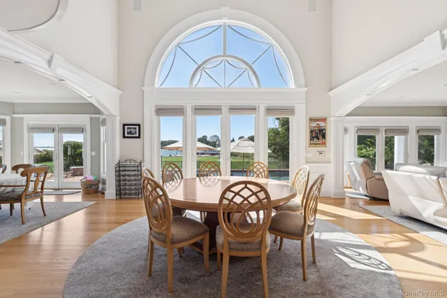 a view of a dining room with furniture wooden floor and a rug