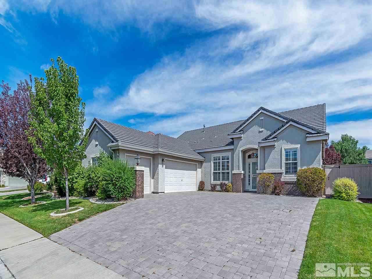 10440 Silver Rush Court Reno, NV 89521 - Photo 1 of 22 a view of a house with a big yard plants and large trees