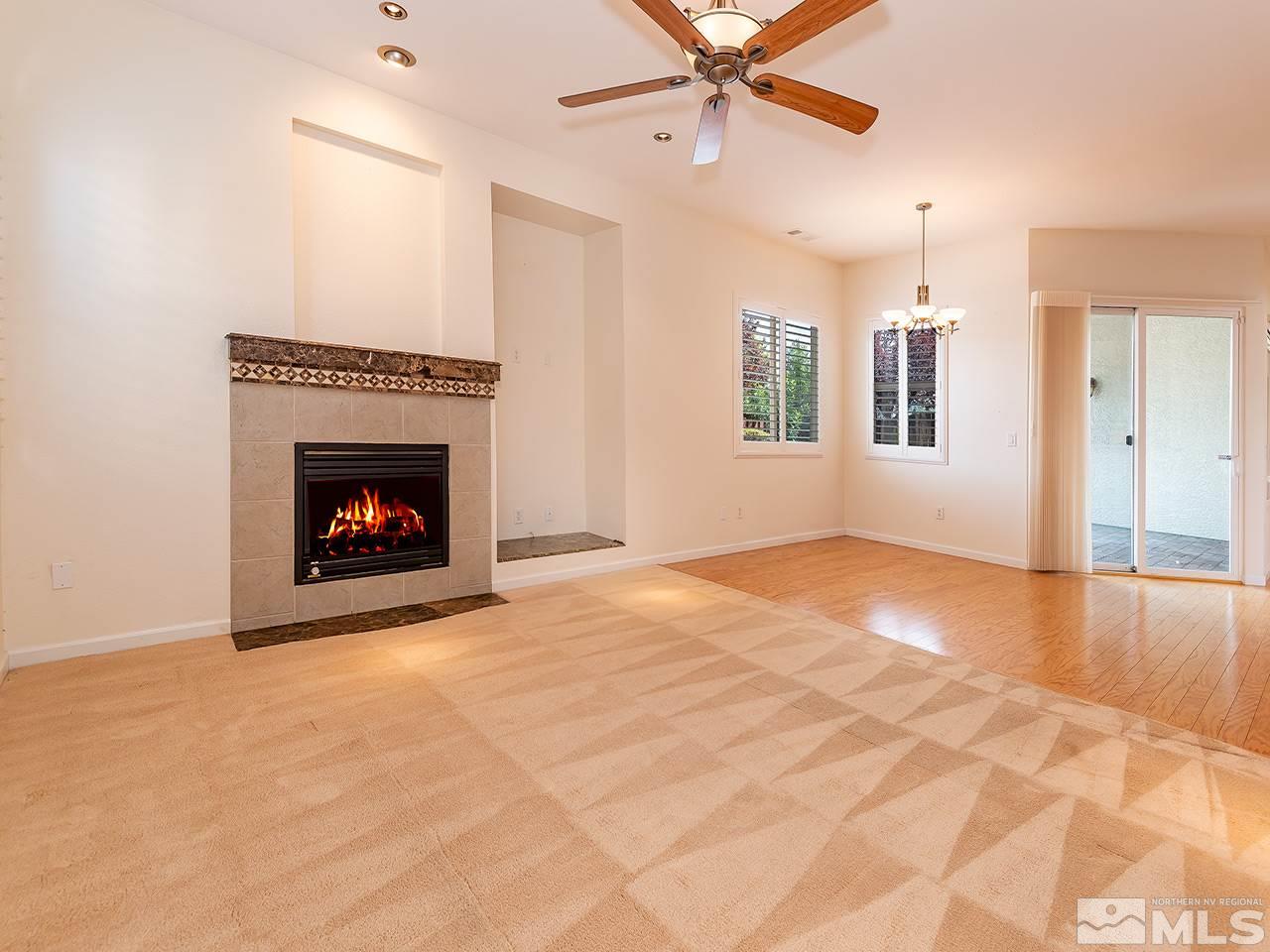 10440 Silver Rush Court Reno, NV 89521 - Photo 11 of 22 an empty room with windows and fireplace