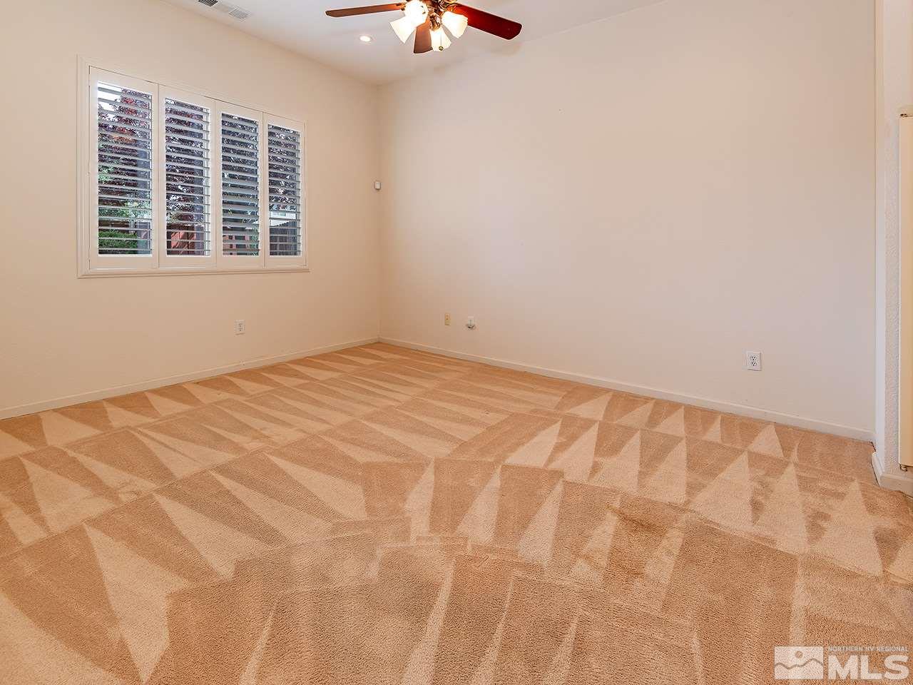 10440 Silver Rush Court Reno, NV 89521 - Photo 13 of 22 a view of an empty room with a window