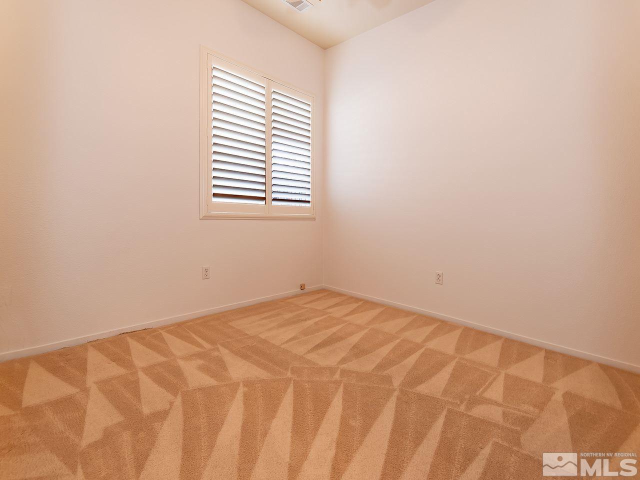 10440 Silver Rush Court Reno, NV 89521 - Photo 16 of 22 a view of empty room with window