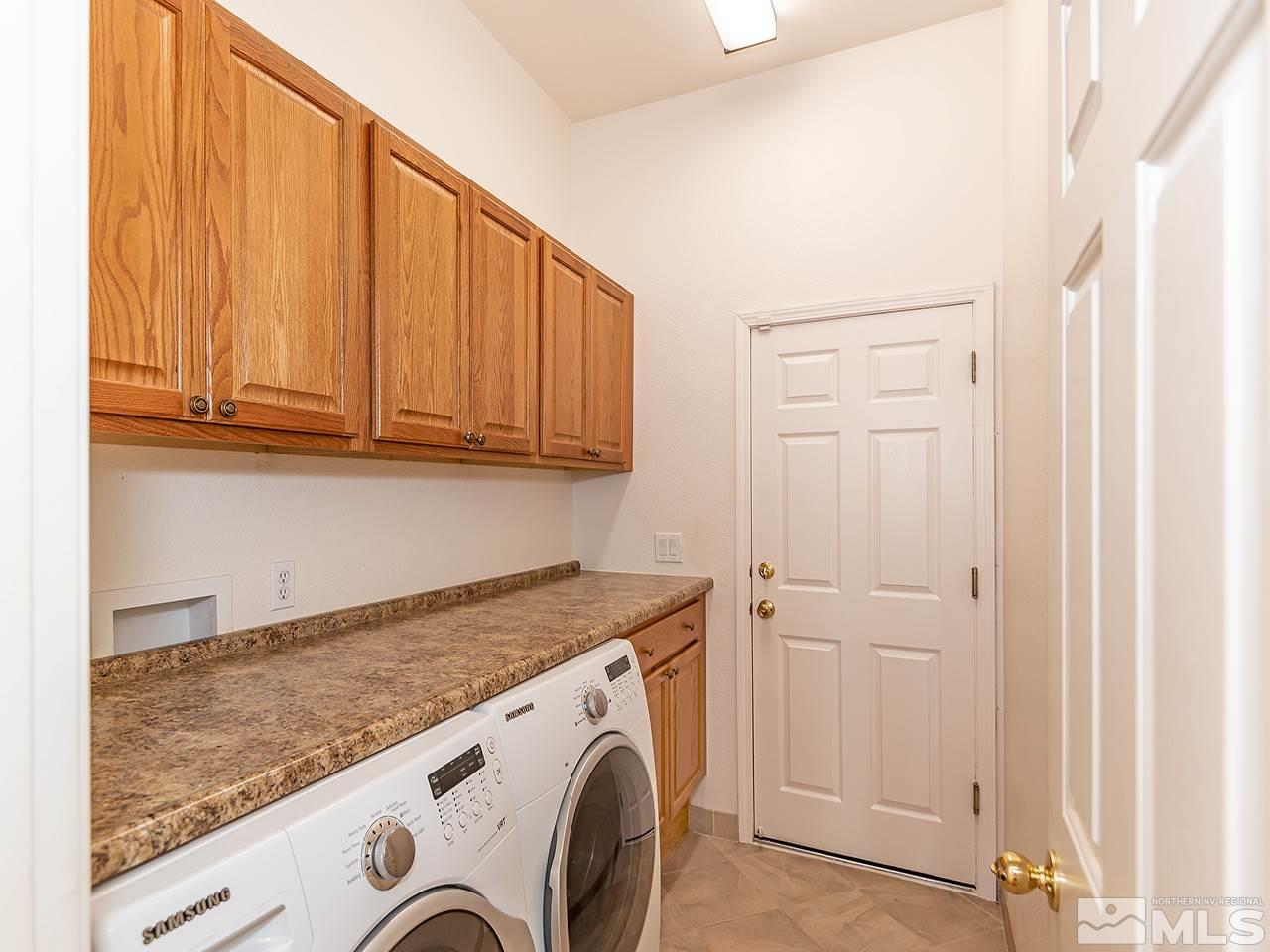 10440 Silver Rush Court Reno, NV 89521 - Photo 19 of 22 a utility room with dryer and washer
