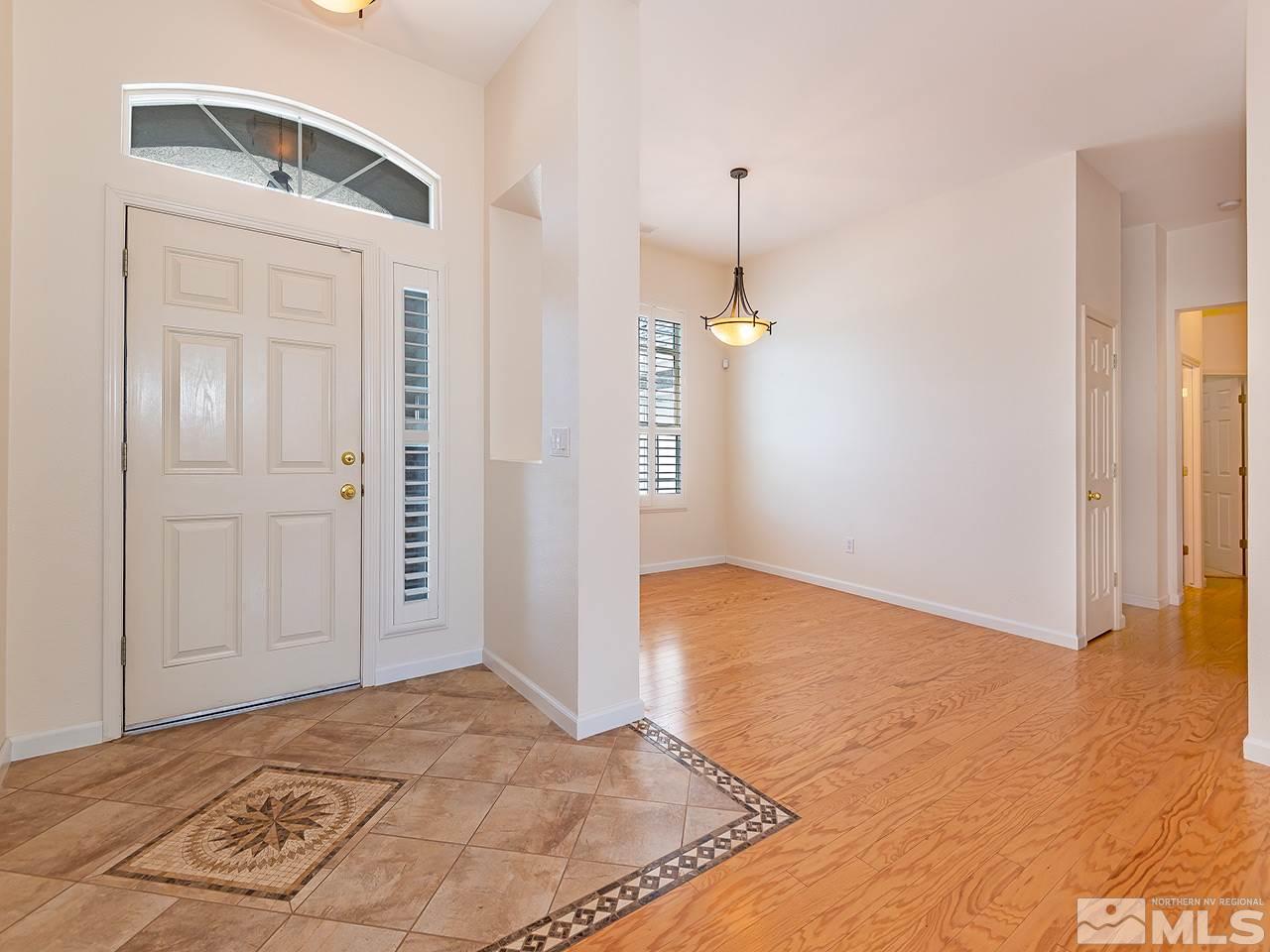 10440 Silver Rush Court Reno, NV 89521 - Photo 2 of 22 an empty room with a natural light