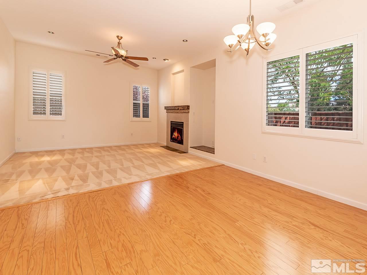 10440 Silver Rush Court Reno, NV 89521 - Photo 10 of 22 a view of livingroom with hardwood floor and ceiling fan