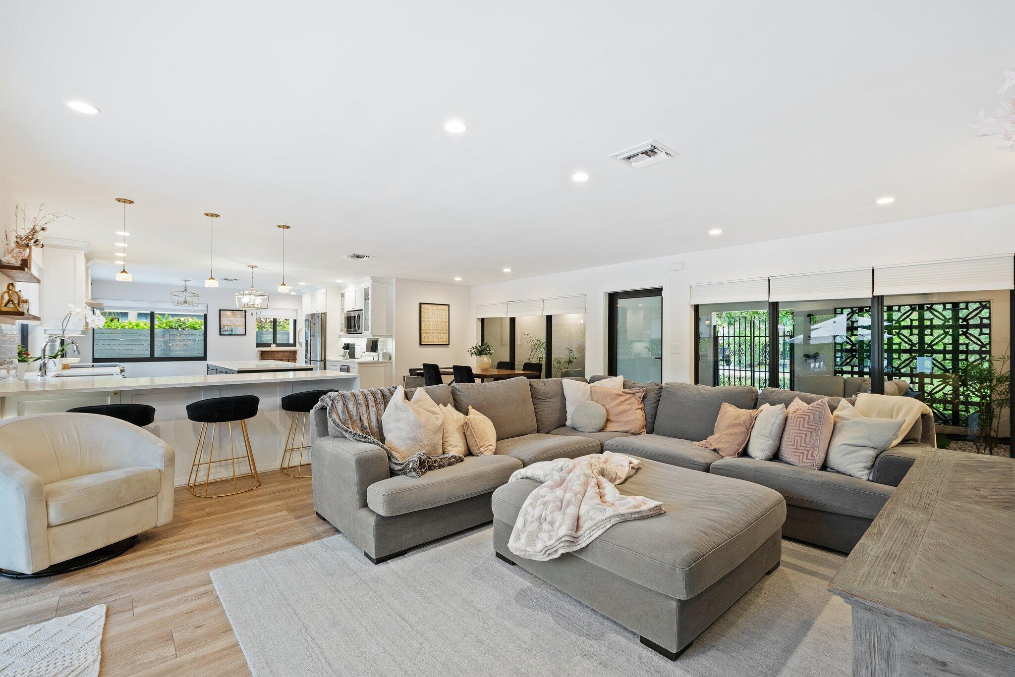 410 Southwest 7th Way Boca Raton, FL 33486 - Photo 3 of 6 a living room with furniture and a large window