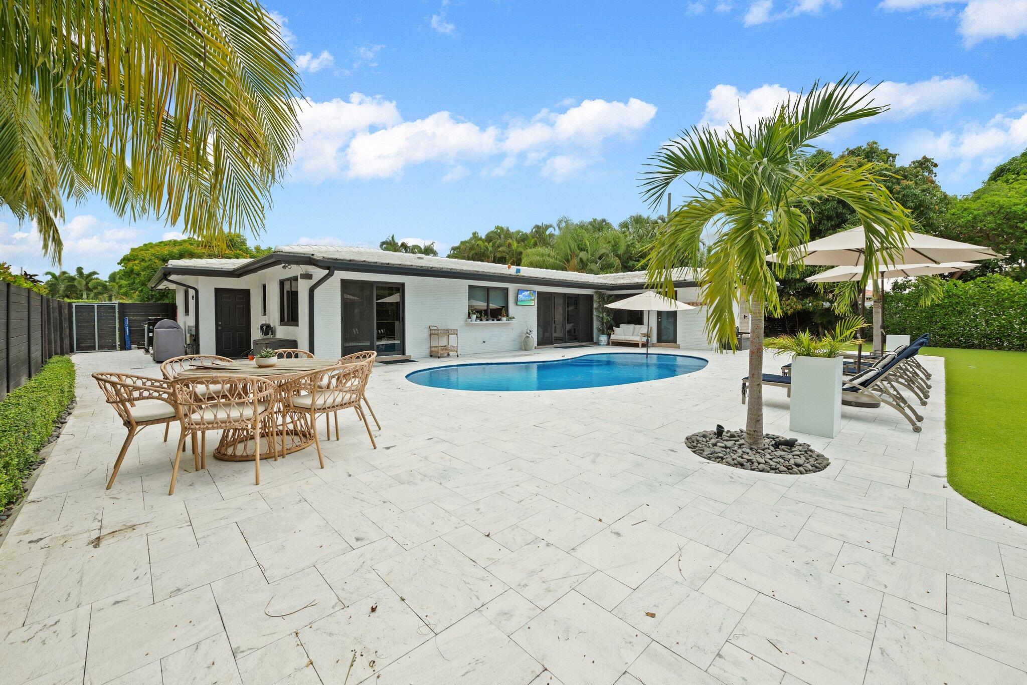 410 Southwest 7th Way Boca Raton, FL 33486 - Photo 5 of 6 a view of a house with backyard porch and sitting area