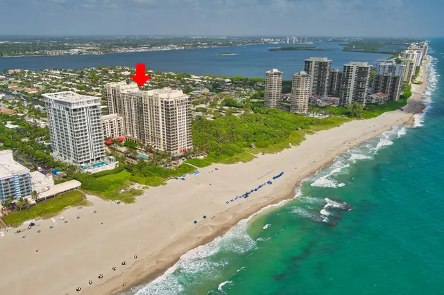 a dining room with stainless steel appliances a table and chairs