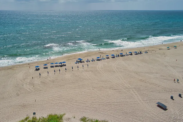 a kitchen with stainless steel appliances granite countertop a refrigerator and a refrigerator