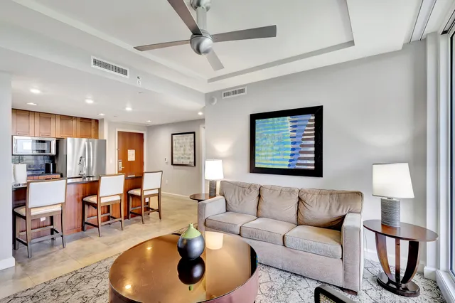 a kitchen with stainless steel appliances granite countertop a refrigerator and a refrigerator