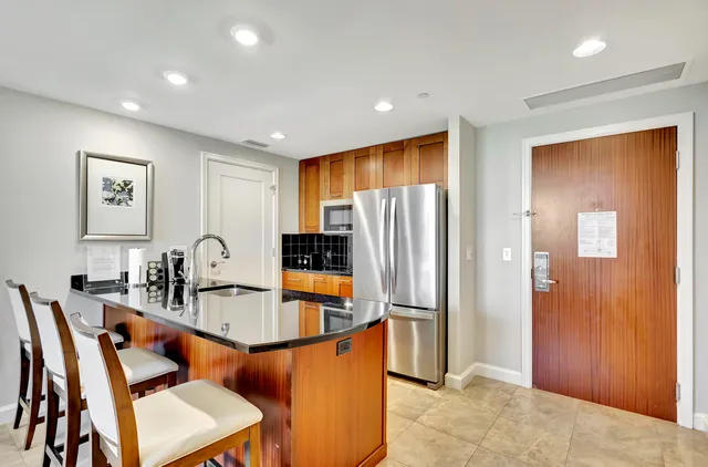 a kitchen with granite countertop a sink and a counter top space