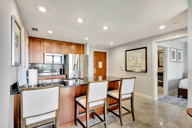 a bedroom with a large bed and a couch