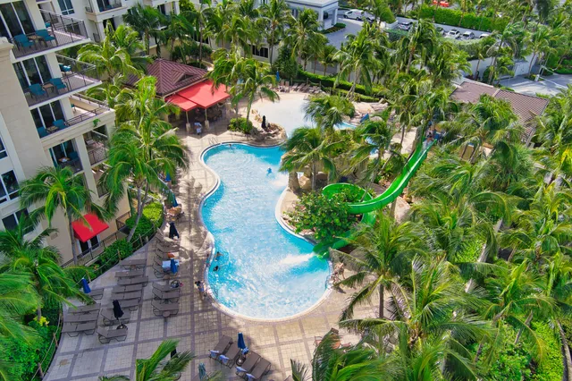 a lobby with furniture and potted plant